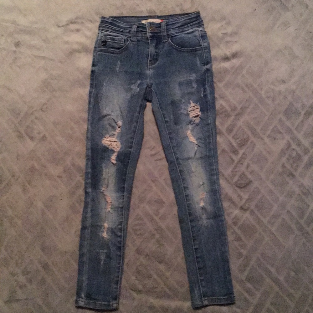 Light wash jeans with rips.